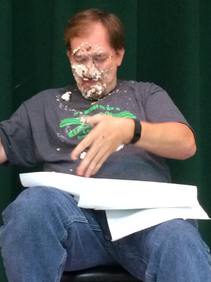 Dr. Driver Cleaning Pie off Face